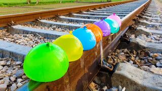 Experiment Balloons vs Throwing Stones On Railway
