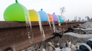 Experiment Balloons vs Throwing Stones On Railway