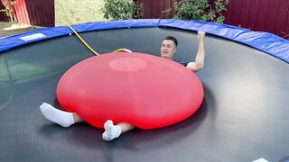 EXPERIMENT MAN under GIANT WATER BALLOON