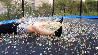 JUST NEVER JUMP ON A GIANT ORBEEZ BALLOON LYING ON A TRAMPOLINE