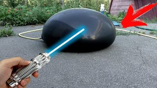 CAN ONE BURN A HUGE WATER BALLOON WITH A POWERFUL LASER?!?