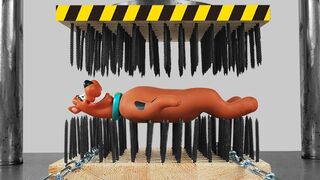 Stretch Scooby Doo Between Bed of Nails