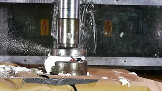 Crushing spray cans with hydraulic press