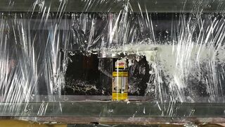 Crushing spray cans with hydraulic press