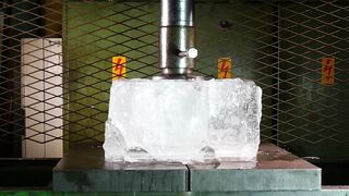 Crushing huge block of ice with hydraulic press