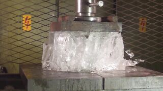 Crushing huge block of ice with hydraulic press