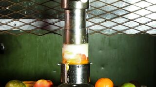 Crushing fruits through a small hole with hydraulic press