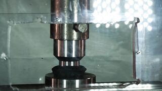 SUPER SLOW MOTION: rubik's cube and hockey puck with hydraulic press