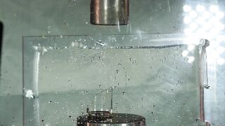 SUPER SLOW MOTION: Soda can and bottles vs. hydraulic press