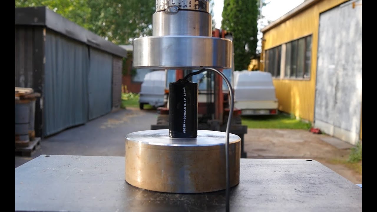 Crushing large lithium batteries with hydraulic press