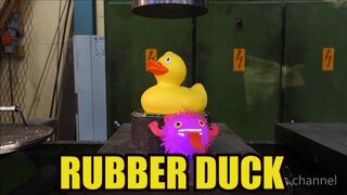 Crushing rubber duck with hydraulic press
