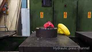 Crushing rubber duck with hydraulic press