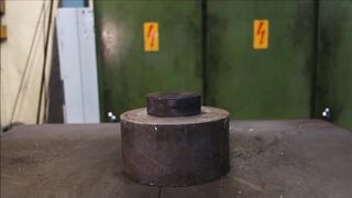 Crushing hockey puck with hydraulic press