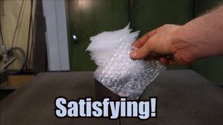 Crushing bubble wrap with hydraulic press