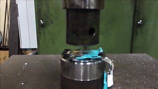 Crushing mobile phone with hydraulic press