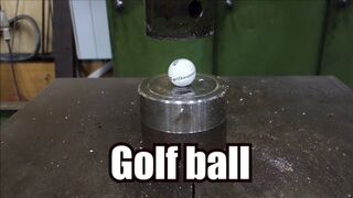 Crushing golf ball with hydraulic press