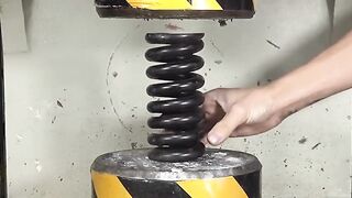 Can a 200-ton pressure crush a giant spring?